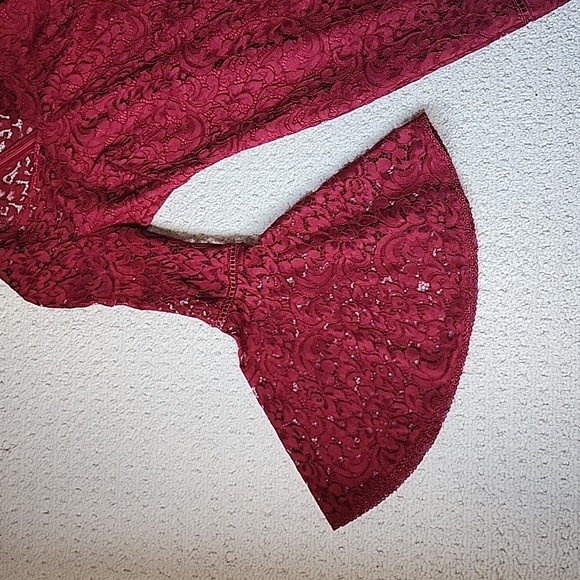 A burgundy lace dress that only wore once. It's in perfect condition. - Picture 2 of 3